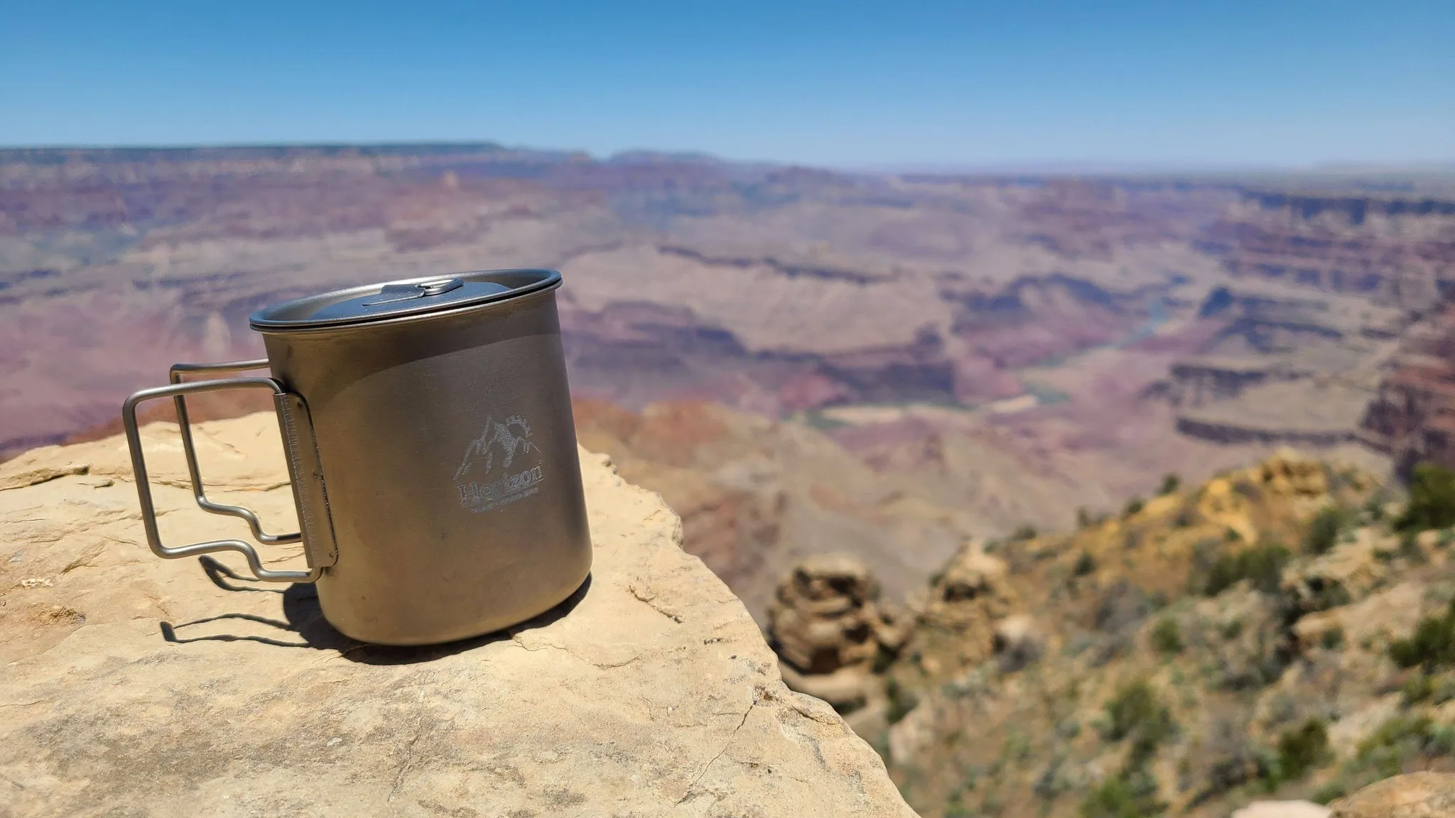 Horizon titanium cup resting on a canyon overlook
