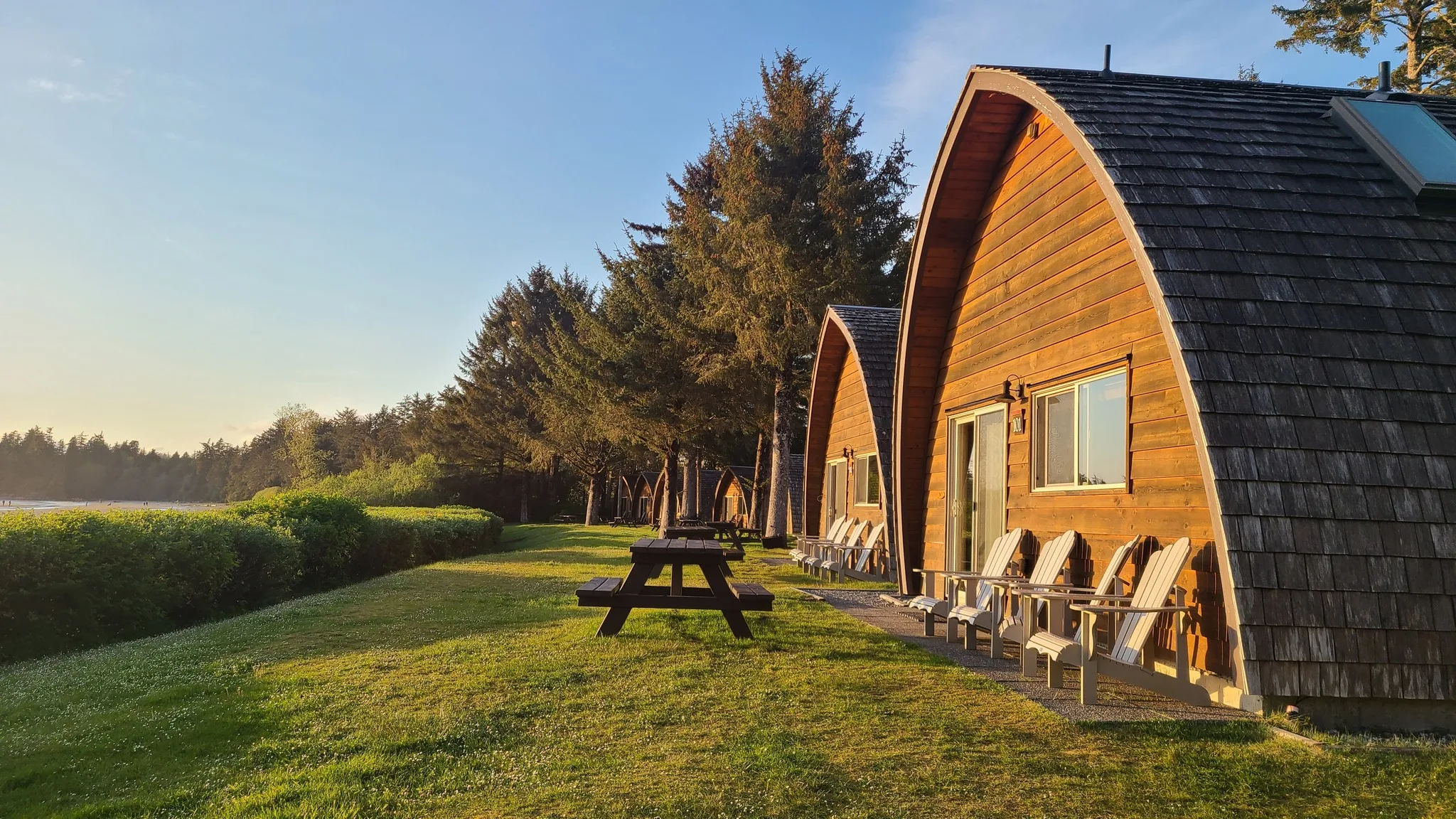 Coastal cabins in evening light during a family outdoor trip